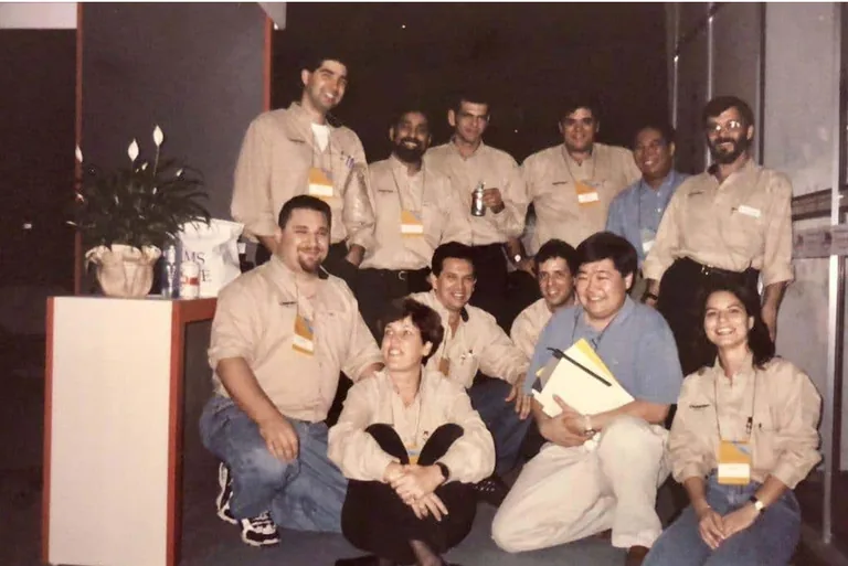 Early CIS team gathered at an industry event.